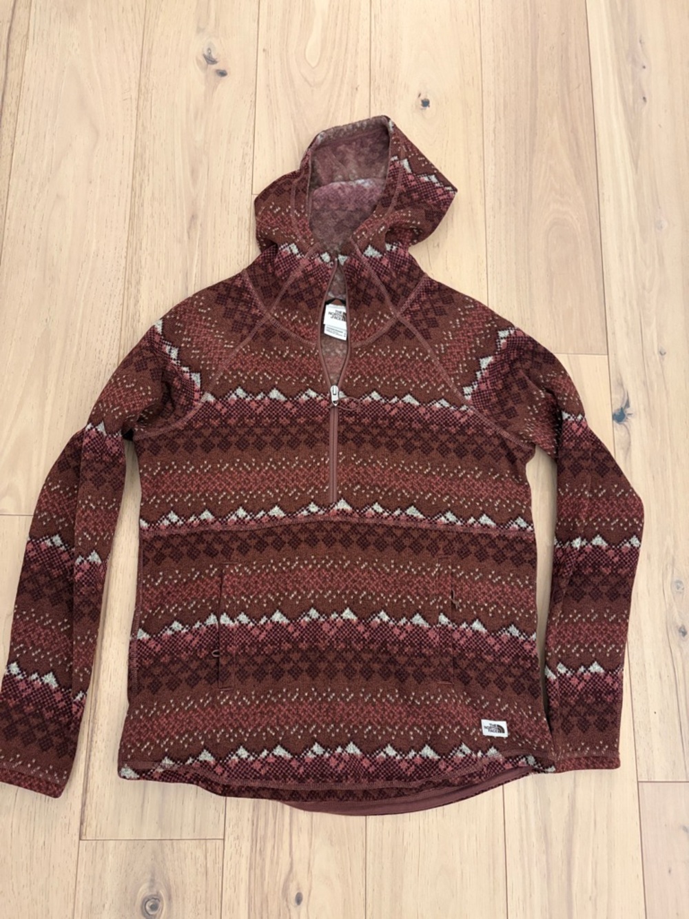 The North Face women’s Zip-Up Hooded Sweater in Rust Brown Pattern